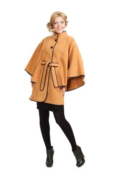 The girl in a yellow autumn coat on a white background