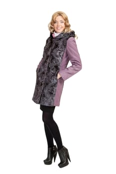 The girl in a violet  autumn coat on a white background