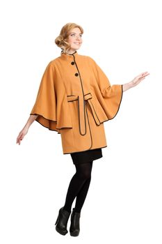 The girl in a yellow autumn coat on a white background