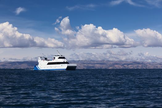 LAKE TITICACA, BOLIVIA - NOVEMBER 5, 2014: Big passenger ferry on Lake Titicaca close to the shore of the popular travel destination of Isla del Sol (Island of the Sun) on November 5, 2014 on Lake Titicaca, Bolivia 