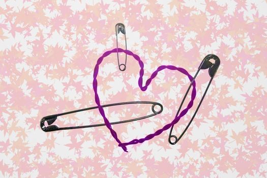 broken heart fixed with safety pins