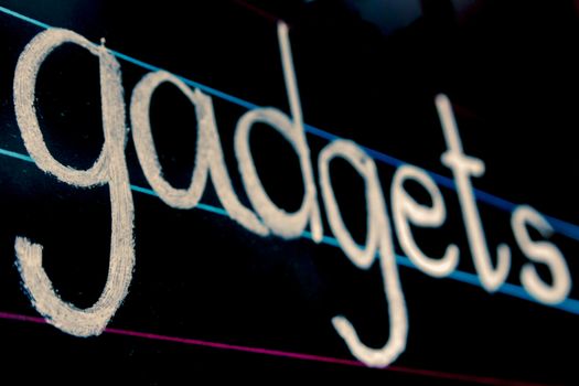 gadgets phrase handwritten on blackboard