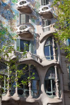 BARCELONA - APRIL 14: The facade of the house Casa Battlo (also could the house of bones) designed by Antoni Gaudi with his famous expressionistic style on April 14, 2012 in Barcelona, Spain