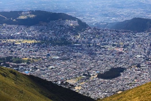 View from West to East over Quito, Ecuador from the Cruz Loma lookout close to the TeleferiQo cablecar station on the Pichincha mountain