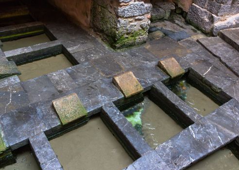 The public wash known as medieval wash-house, is located within the old city walls