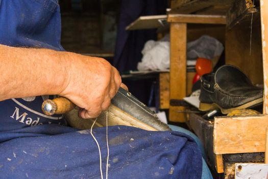 the old trade of shoemaker, now only ancient traditions cultivate a hobby