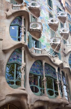 BARCELONA - APRIL 14: The facade of the house Casa Battlo (also could the house of bones) designed by Antoni Gaudi with his famous expressionistic style on April 14, 2012 in Barcelona, Spain