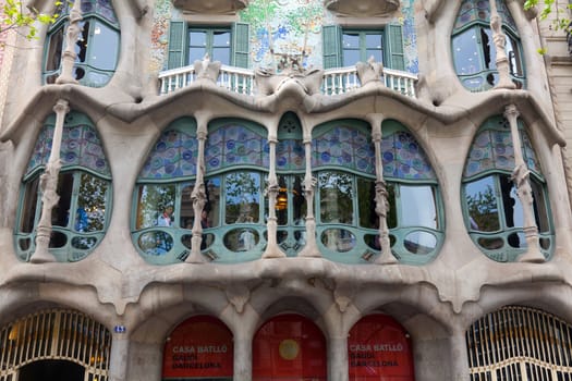 BARCELONA - APRIL 14: The facade of the house Casa Battlo (also could the house of bones) designed by Antoni Gaudi with his famous expressionistic style on April 14, 2012 in Barcelona, Spain