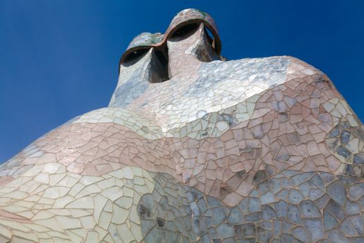 BARCELONA - APRIL 14: Roof architecture at Casa Batllo, (also could the house of bones) designed by Antoni Gaudi with his famous expressionistic style on April 14, 2012 in Barcelona, Spain