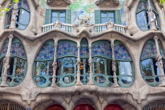 BARCELONA - APRIL 14: The facade of the house Casa Battlo (also could the house of bones) designed by Antoni Gaudi with his famous expressionistic style on April 14, 2012 in Barcelona, Spain