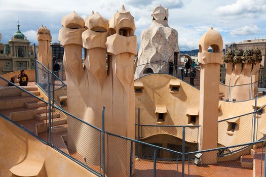 BARCELONA, SPAIN - APRIL 14: Antoni Gaudi's work at the roof of Casa Mila on Apr 14, 2012 in Barcelona, Spain. Popularly known as La Pedrera, this modernist house was built between 1906 and 1910.