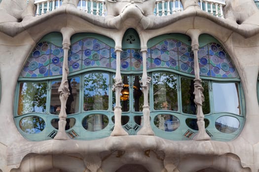 BARCELONA - APRIL 14: The facade of the house Casa Battlo (also could the house of bones) designed by Antoni Gaudi with his famous expressionistic style on April 14, 2012 in Barcelona, Spain