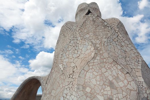 BARCELONA - APR 14: Chimneys covered with ceramic fragments that look like helmets at La Pedrera (Casa Mila) on Apr 14, 2012 in Barcelona, Spain. Casa Mila was built in 1910 by Antoni Gaudi.