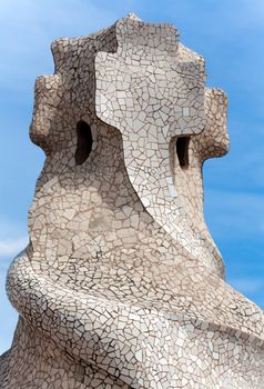BARCELONA - APR 14: Chimneys covered with ceramic fragments that look like helmets at La Pedrera (Casa Mila) on Apr 14, 2012 in Barcelona, Spain. Casa Mila was built in 1910 by Antoni Gaudi.