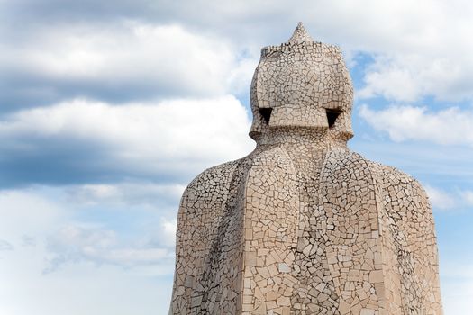 BARCELONA - APR 14: Chimneys covered with ceramic fragments that look like helmets at La Pedrera (Casa Mila) on Apr 14, 2012 in Barcelona, Spain. Casa Mila was built in 1910 by Antoni Gaudi.