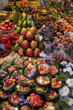 BARCELONA, SPAIN - APRIL 14: Famous La Boqueria market with vegetables and fruits on April 14, 2012 in Barcelona, Spain. One of the oldest markets in Europe that still exist. Established 1217.