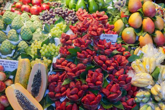 BARCELONA, SPAIN - APRIL 14: Famous La Boqueria market with vegetables and fruits on April 14, 2012 in Barcelona, Spain. One of the oldest markets in Europe that still exist. Established 1217.