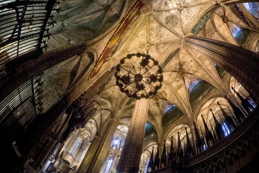 The Cathedral of the Holy Cross and Saint Eulalia also known as Barcelona Cathedral, is the Gothic cathedral and seat of the Archbishop of Barcelona, Spain. The cathedral was constructed throughout the 13th to 15th centuries, with the principal work done in the 14th century. The cloister, which encloses the Well of the Geese was completed about 1450. The neo-Gothic facade was constructed over the nondescript exterior that was common to Catalan churches in the 19th century. The roof is notable for its gargoyles, featuring a wide range of animals, both domestic and mythical.