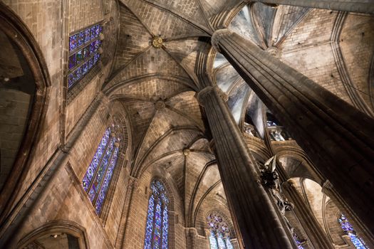 The Cathedral of the Holy Cross and Saint Eulalia also known as Barcelona Cathedral, is the Gothic cathedral and seat of the Archbishop of Barcelona, Spain. The cathedral was constructed throughout the 13th to 15th centuries, with the principal work done in the 14th century. The cloister, which encloses the Well of the Geese was completed about 1450. The neo-Gothic facade was constructed over the nondescript exterior that was common to Catalan churches in the 19th century. The roof is notable for its gargoyles, featuring a wide range of animals, both domestic and mythical.