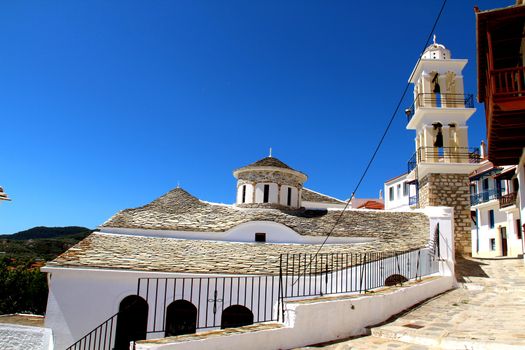 Photo shows Greek old village houses and their surroundings.