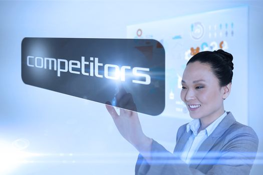 Businesswoman pointing to word competitors against technology interface