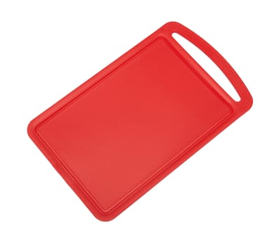 Red plastic cutting board isolated on white