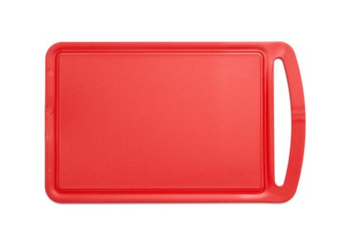 Red plastic cutting board isolated on white