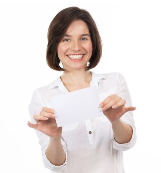 Young brunette showing a white signboard, isolated on white