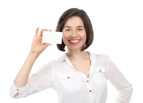 Pretty young brunette presenting a white business card, isolated on white