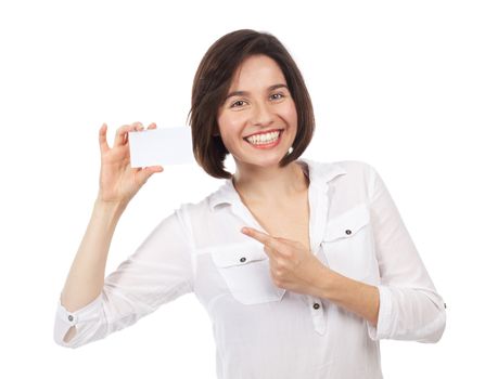 Pretty young woman pointing a blank business card, isolated on white