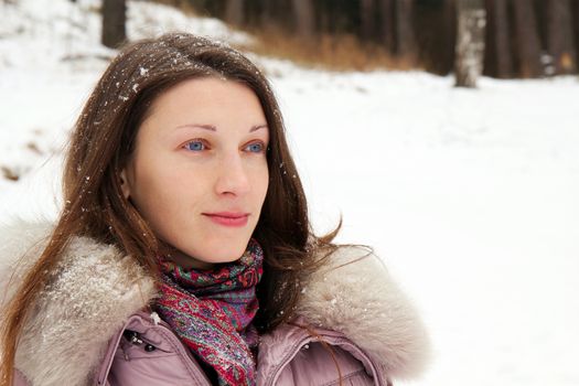 Portrait of young woman in winter