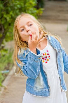 Cute beautiful girl makes faces imitate witch