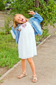 Cute beautiful girl makes faces imitate witch