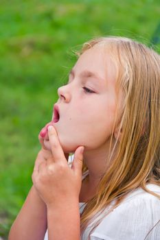 Cute beautiful girl makes faces imitate witch