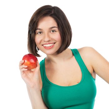 Beautiful young brunette holding a red apple, isolated on white