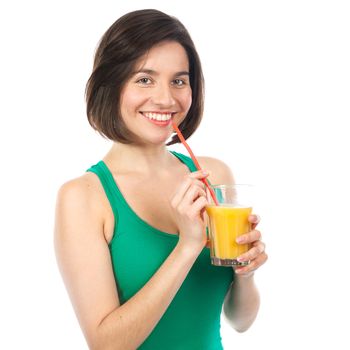 Portrait of a woman drinking an orange juice with a straw, isolated on white