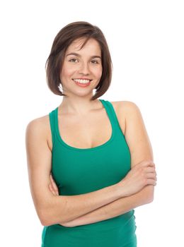 Portrait of a young smiling woman looking relaxed, confident, with her arms crossed, isolated on white