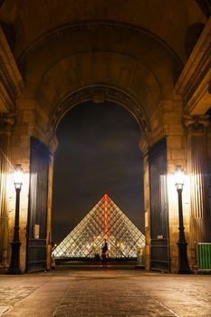 PARIS - OCTOBER 12: The Louvre Pyramid on October 12, 2014 in Paris, France. It serves as the main entrance to the Louvre Museum. Completed in 1989 it has become a landmark of Paris.