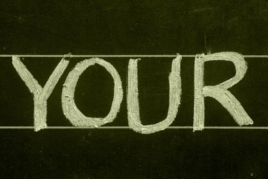 your word handwritten on black chalkboard