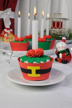Muffins in the form of a Christmas flower cream and marzipan