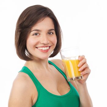 Portrait of a pretty brunette drinking an orange juice, isolated on white