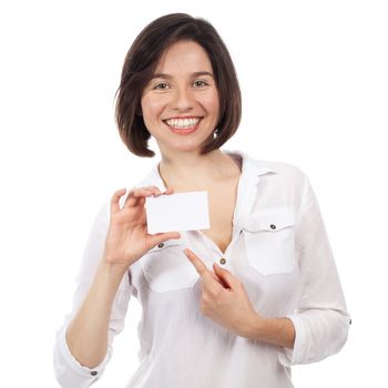 Beautiful young woman pointing a blank business card, isolated on white