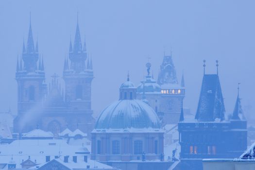 prague - spires of the old town during heavy snowfall