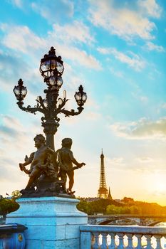 Lamppost at the Alexander III bridge in Paris at sunrise