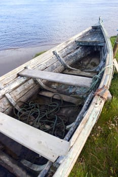 old row boat on the bank of the river Cashen in county Kerry Ireland