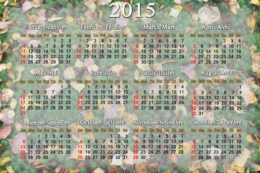 calendar for 2015 year on the background of green moss and autumn leaves