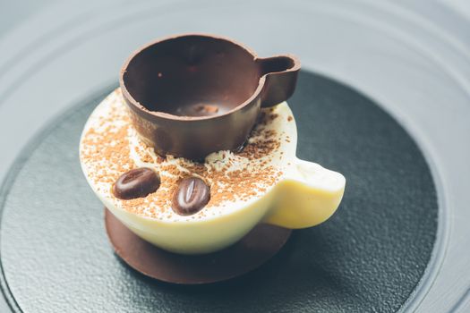 Tiramisu Dessert with Cinnamon and Coffee. Garnished with Chocolate