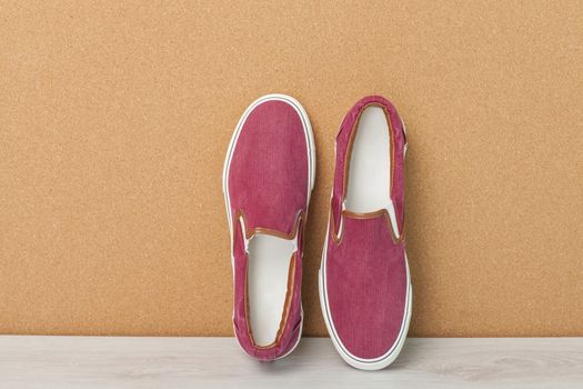 Red Sneaker on a Wood Background, slip-on shoes