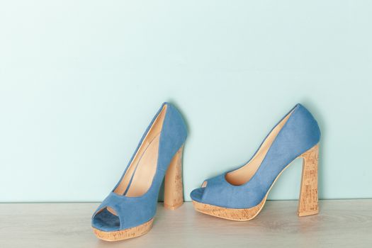 Fashionable Peeptoe High Heels on blue background