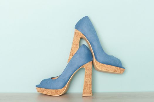 Fashionable Peeptoe High Heels on blue background